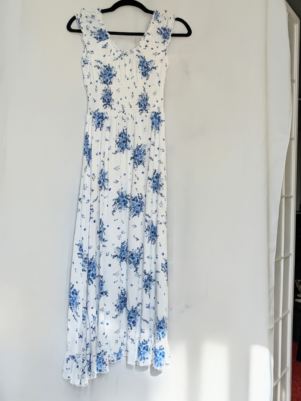 Sleeveless White Maxi Dress with Blue Floral Print